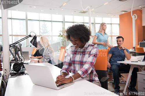 Image of African American informal business woman working in the office