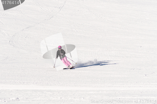 Image of Female skier on empty ski slope