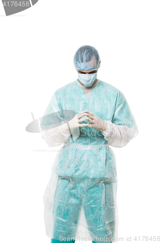 Image of Surgeon portrait. isolated on white background. focuses on reflection. fingers pyramid. praying