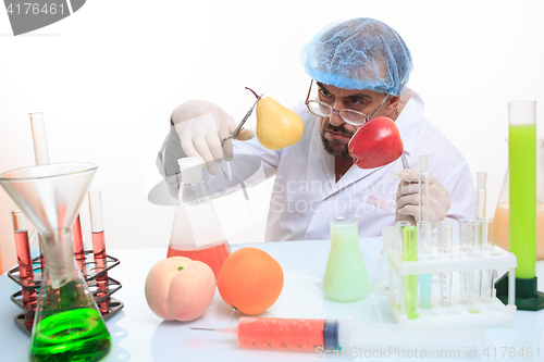 Image of scientist fills chemicals fruit and vegetables