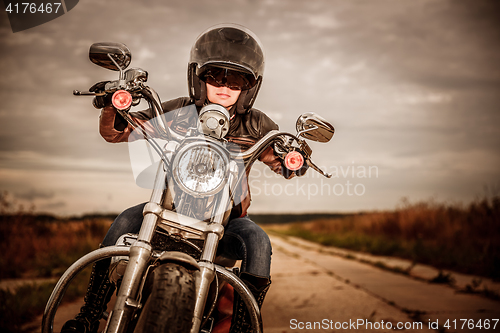 Image of Biker girl on a motorcycle