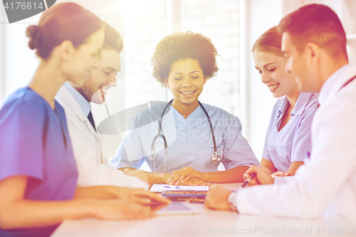 Image of group of happy doctors meeting at hospital office