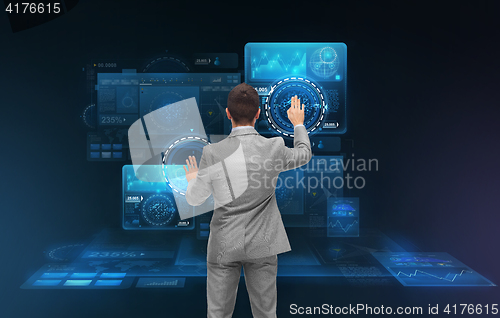 Image of businessman working with virtual screens