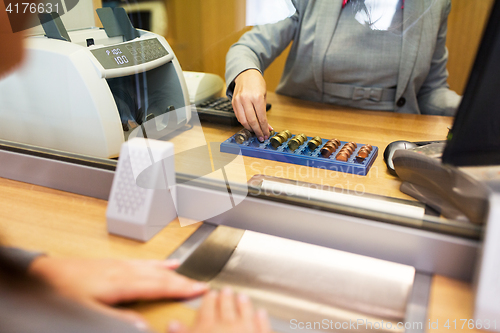 Image of clerk counting cash money at bank office