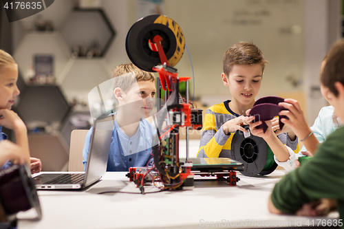 Image of happy children with 3d printer at robotics school