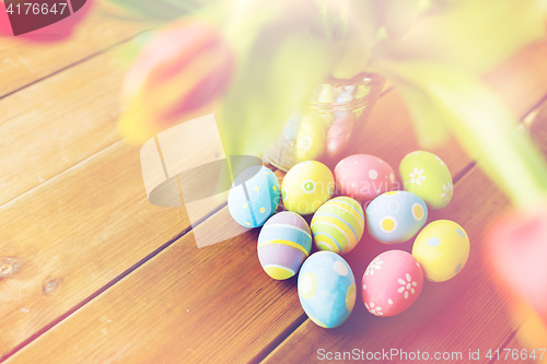 Image of close up of easter eggs and flowers in bucket