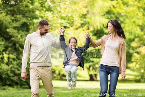 Image of happy family walking in summer park and having fun