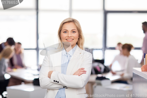 Image of smiling businesswoman at office