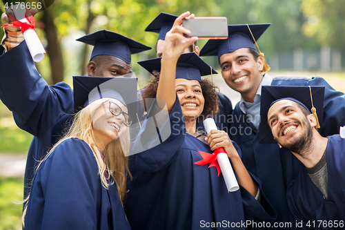 Image of students or bachelors taking selfie by smartphone