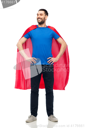 Image of happy man in red superhero cape