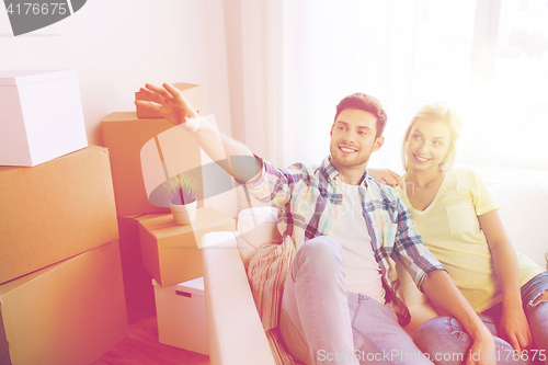 Image of couple with boxes moving to new home and dreaming