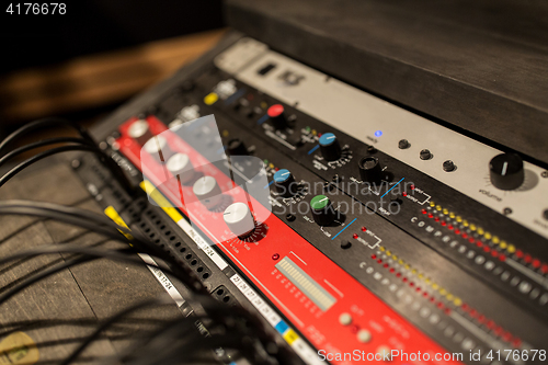 Image of music mixing console at sound recording studio