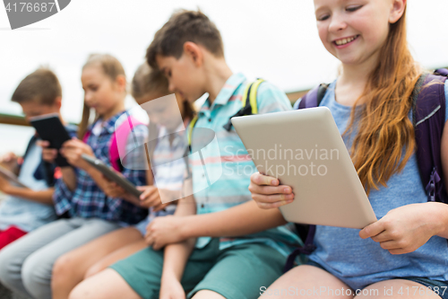 Image of close up of elementary students with tablet pc