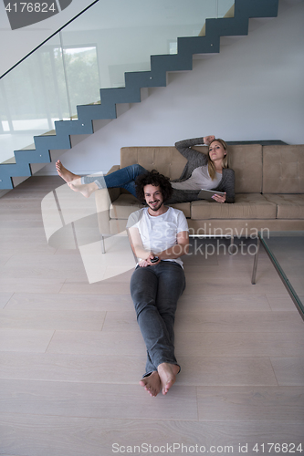 Image of young couple relaxes in the living room