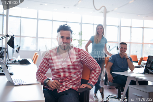 Image of Portrait of young informal businessman