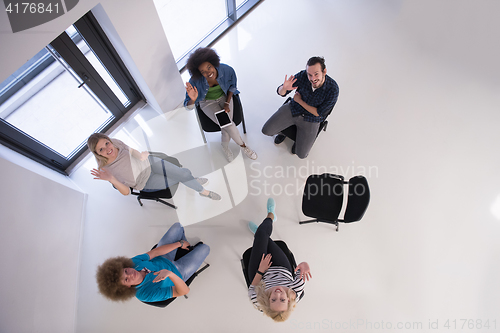Image of Multiethnic startup business team on meeting  top view