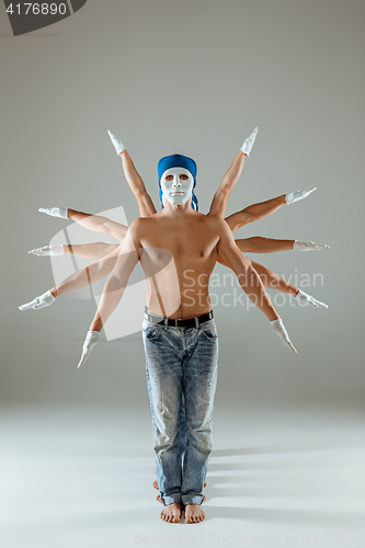 Image of The group of caucasian men in white masks and hats, jeans