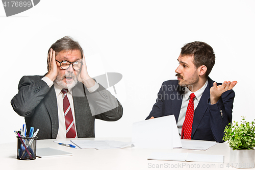 Image of The two colleagues working together at office on white background.