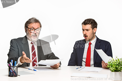 Image of The two colleagues working together at office on white background.