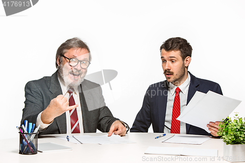 Image of The two colleagues working together at office on white background.