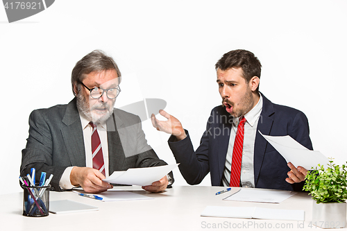 Image of The two colleagues working together at office on white background.