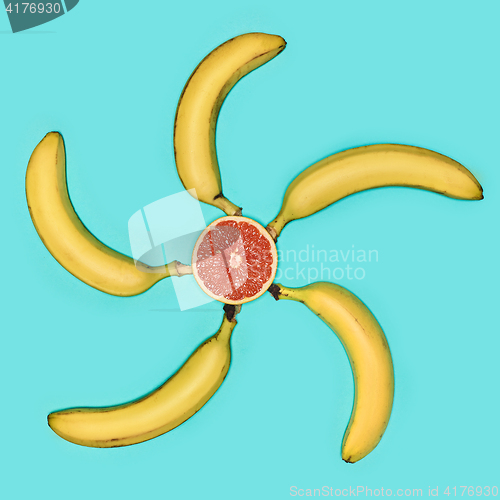 Image of The group of bananas against blue background