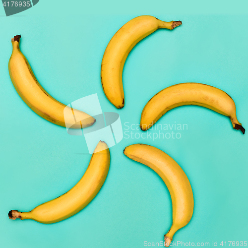 Image of The group of bananas against blue background