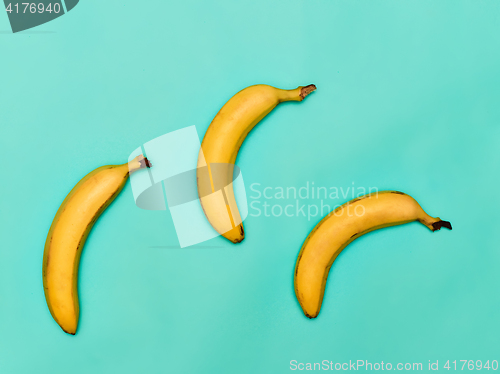 Image of The group of bananas against blue background