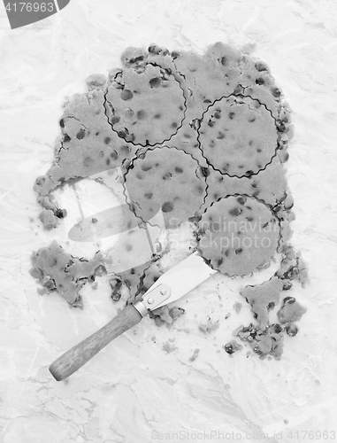 Image of Circles in chocolate chip cookie dough with palette knife