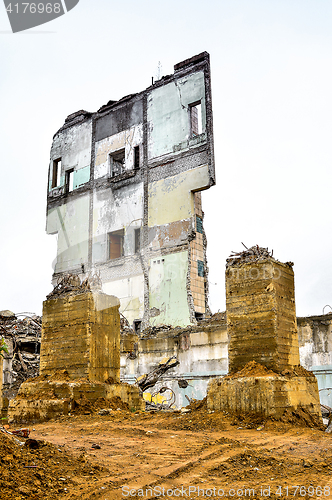 Image of Pieces of Metal and Stone are Crumbling from Demolished Building