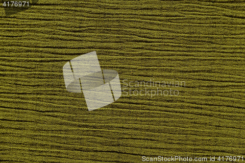 Image of Olive green crinkled material background texture