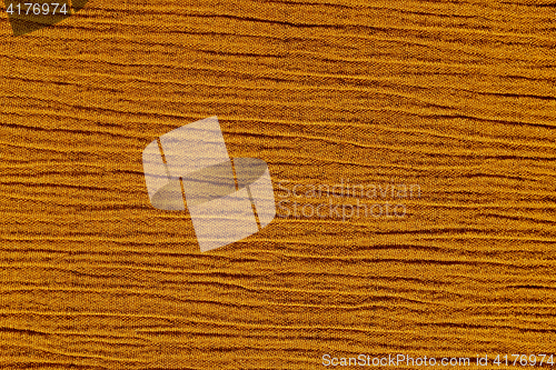 Image of Gold ochre crinkled material background texture