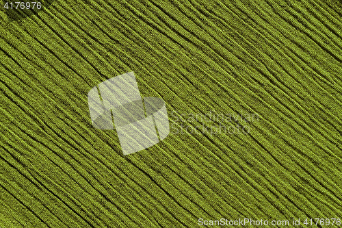 Image of Light green crinkled fabric background texture