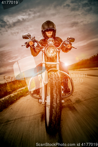 Image of Biker girl on a motorcycle