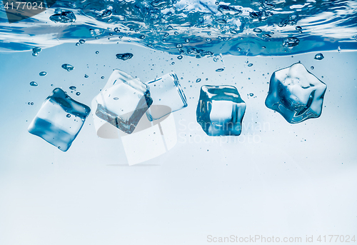 Image of Ice cubes falling under water