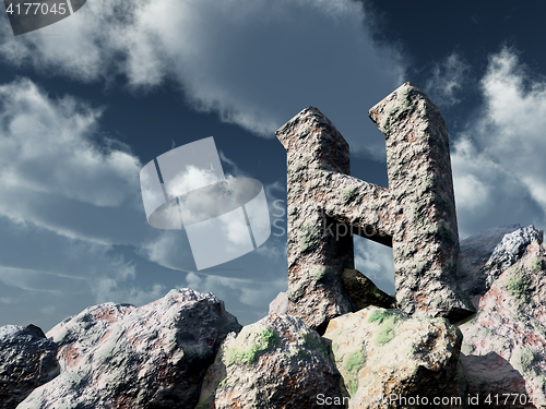 Image of rune rock under cloudy blue sky - 3d illustration