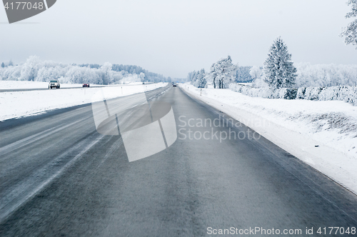 Image of Highway in the winter, the trees covered with hoarfrost