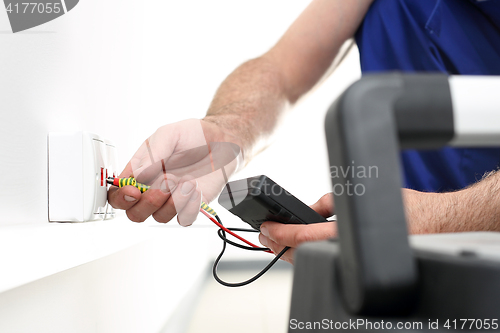 Image of Electrician Installing Internet