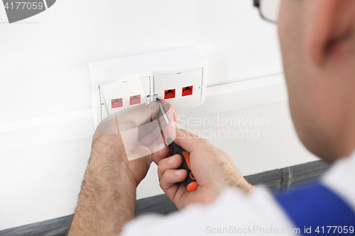 Image of Electrician Installing Internet