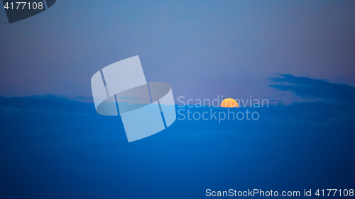 Image of Full moon at sunset