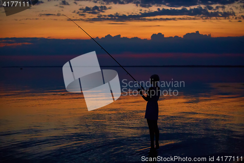 Image of Fishing Silhouette on dramatic sky and sea