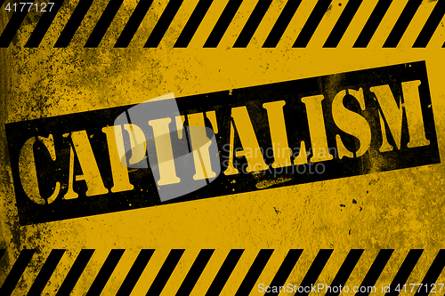 Image of Capitalism sign yellow with stripes