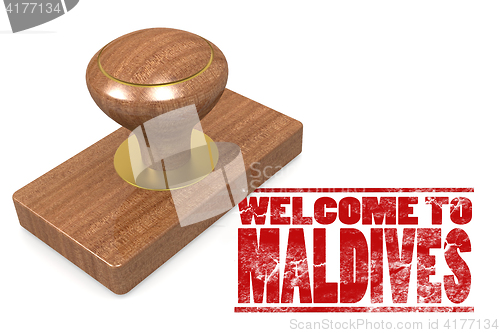 Image of Red rubber stamp with welcome to Maldives