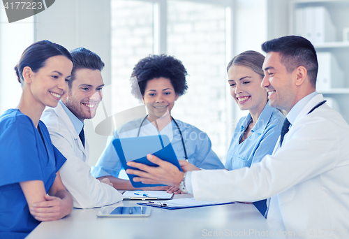 Image of group of happy doctors meeting at hospital office