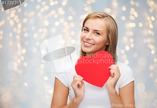 Image of happy woman or teen girl with red heart shape