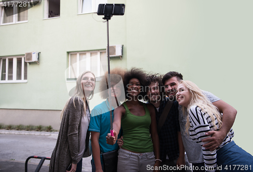 Image of Group of friends taking picture of themselves