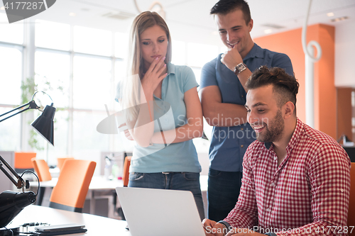 Image of Group of young people employee workers with computer