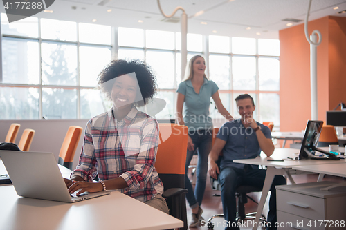 Image of African American informal business woman working in the office