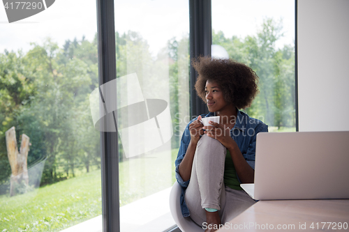 Image of African American woman in the living room