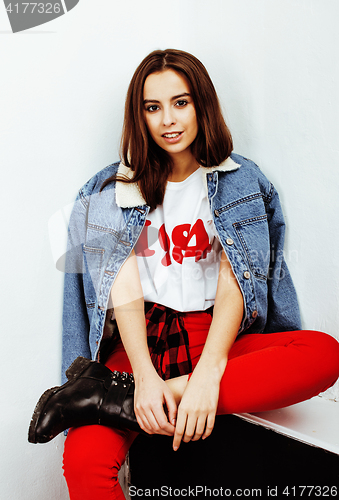 Image of young pretty teenage hipster girl posing emotional happy smiling on white background, lifestyle people concept 